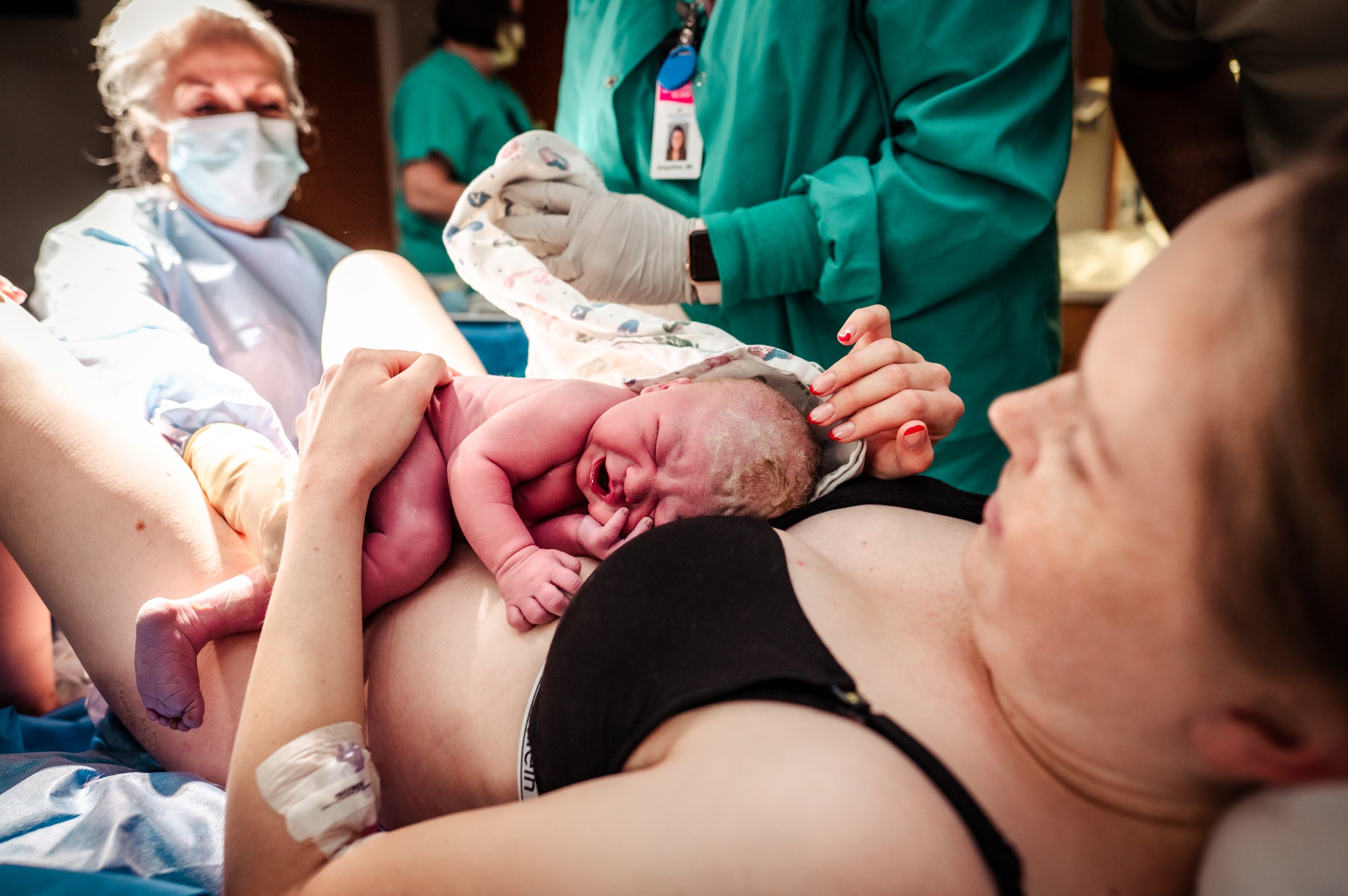 Newborn baby on moms chest